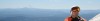 A view of the mountains from the top of a mountain.