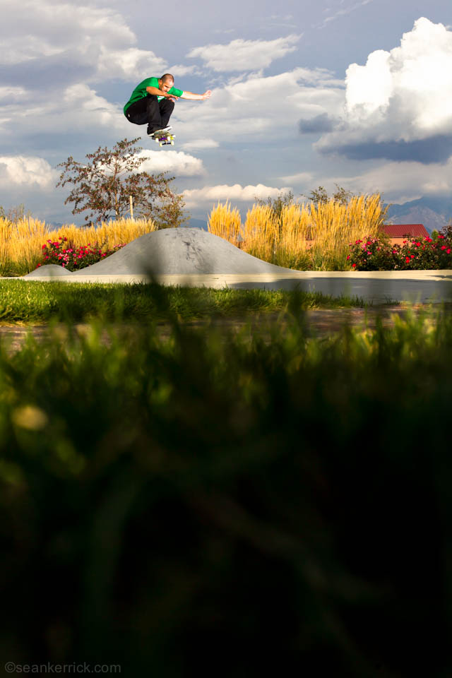 A person on a skateboard doing tricks in the air.